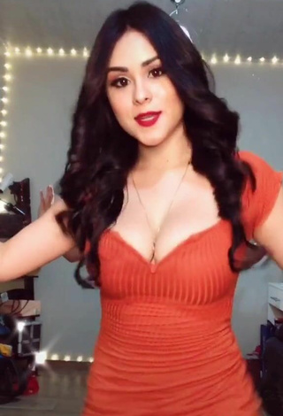 5. Cute Ónice Flores Shows Cleavage in Orange Dress and Bouncing Boobs