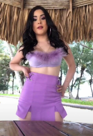 2. Alluring Ónice Flores Shows Cleavage in Erotic Purple Crop Top