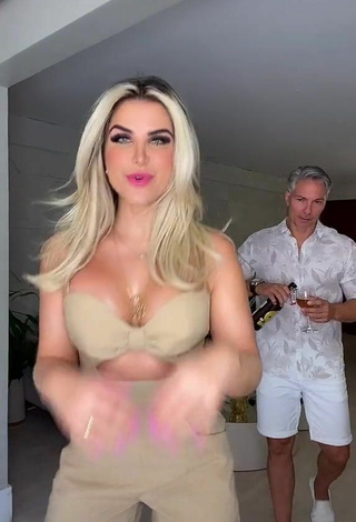 Sexy Pricylla Pedrosa Shows Cleavage in Beige Overall