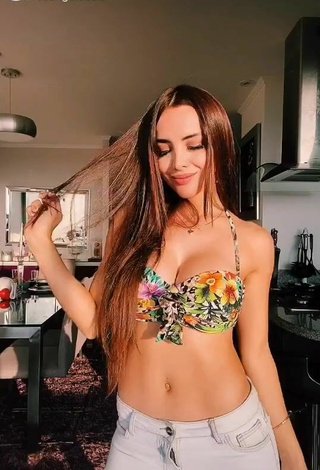 Seductive Rosángela Espinoza Shows Cleavage in Floral Bikini Top