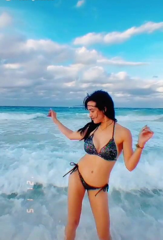 2. Sensual Rosángela Espinoza Shows Cleavage in Black Bikini at the Beach