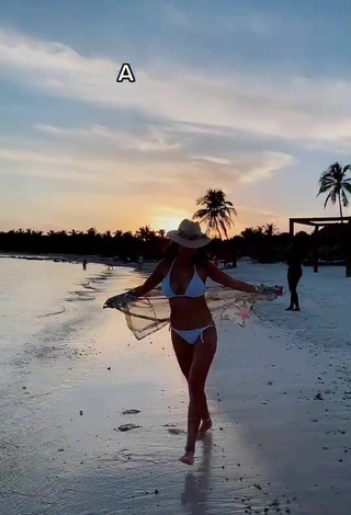 3. Elegant Rosángela Espinoza Shows Cleavage in White Bikini at the Beach