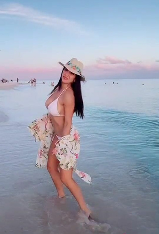 5. Elegant Rosángela Espinoza Shows Cleavage in White Bikini at the Beach