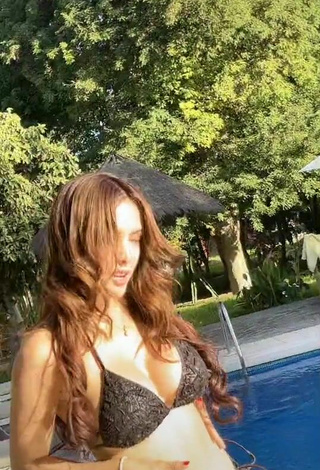 Pretty Rosángela Espinoza Shows Cleavage in Black Bikini at the Swimming Pool
