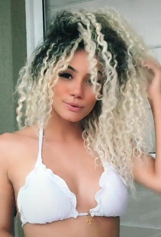 Attractive Sandra Costa Shows Cleavage in Bikini Top