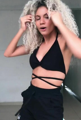 5. Breathtaking Sandra Costa Shows Cleavage in Black Bikini Top