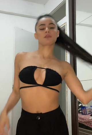 Hot Sandra Costa Shows Cleavage in Black Bikini Top