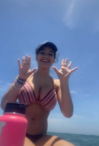 5. Sweet Sofia Gomez Shows Cleavage in Cute Striped Bikini Top on a Boat