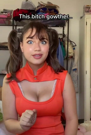 2. Cute Sofia Gomez Shows Cleavage in Orange Dress and Bouncing Boobs