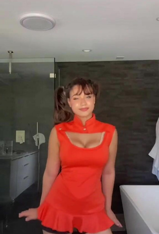 1. Hot Sofia Gomez Shows Cleavage in Orange Dress and Bouncing Boobs