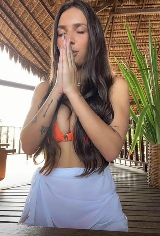 Sexy Stéfani Bays Shows Cleavage in Orange Bikini Top