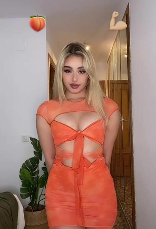 2. Sweetie Teressa Dillon Shows Cleavage in Orange Dress