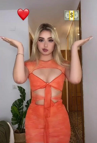 5. Sweetie Teressa Dillon Shows Cleavage in Orange Dress