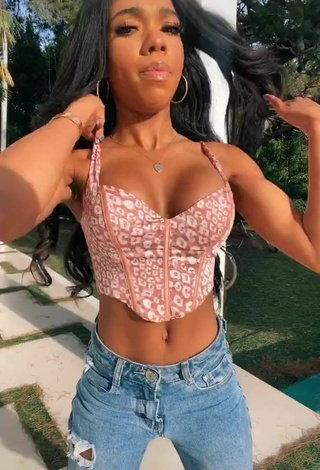 2. Beautiful Teala Dunn Shows Cleavage in Sexy Leopard Crop Top
