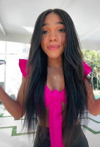 3. Hot Teala Dunn Shows Cleavage in Firefly Rose Crop Top