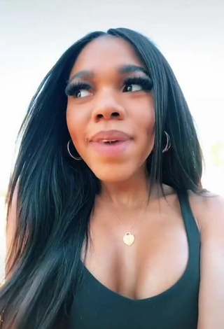 Sexy Teala Dunn Shows Cleavage in Black Top