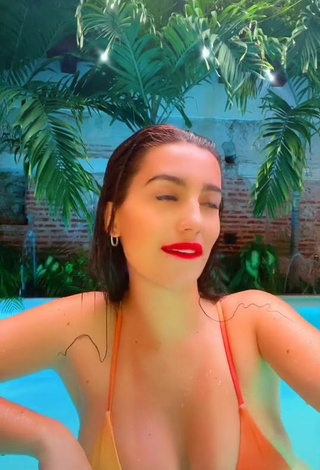 5. Sexy Valentina Gómez Shows Cleavage in Orange Bikini at the Swimming Pool