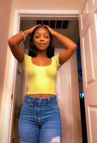 2. Sexy Shania Christian Shows Cleavage in Yellow Crop Top
