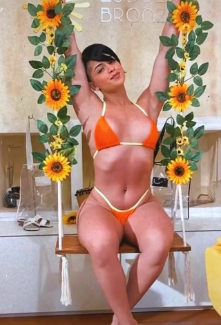 4. Yanne in Seductive Orange Bikini