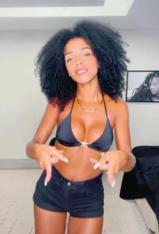 3. Sweetie Brunna Gonçalves Shows Cleavage in Black Bikini Top