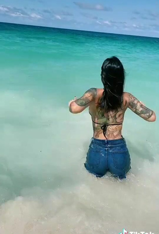 5. Sweetie Jenn Muriel in Black Bikini Top in the Sea at the Beach