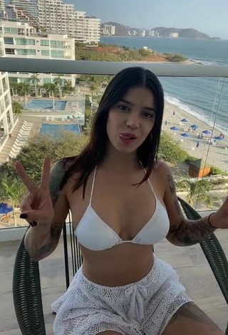 Hot Jenn Muriel Shows Cleavage in White Bikini Top on the Balcony