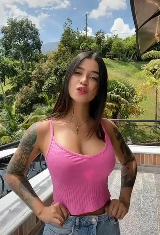 3. Cute Jenn Muriel Shows Cleavage in Pink Crop Top on the Balcony