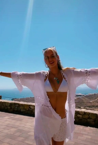 5. Sexy Jessica Belkin Shows Cleavage in White Bikini Top on the Balcony