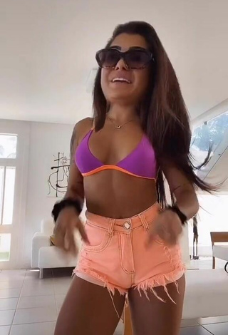 Seductive Marina Ferrari Shows Cleavage in Violet Bikini Top
