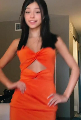 3. Hot Rachel Brockman in Orange Dress