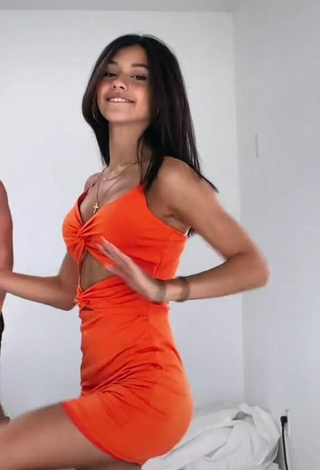 3. Sexy Rachel Brockman Shows Cleavage in Orange Dress