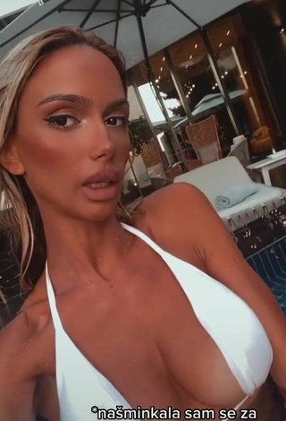 Sexy Sara Damnjanović Shows Cleavage in White Bikini at the Swimming Pool