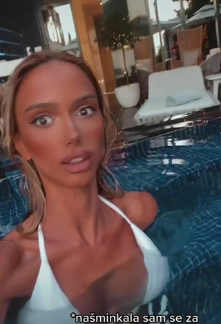 4. Sexy Sara Damnjanović Shows Cleavage in White Bikini at the Swimming Pool
