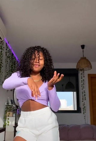 Pretty Tania Fernández Shows Cleavage in Purple Crop Top