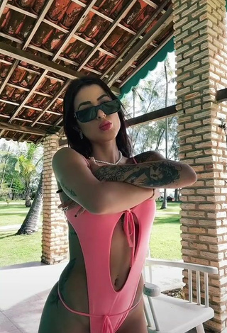 Cute Amanda Ferreira Shows Cleavage in Pink Swimsuit