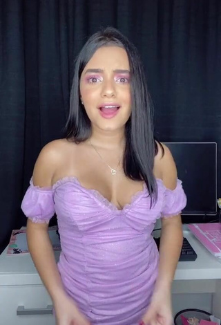 Sweetie Bela Almada Shows Cleavage in Purple Dress