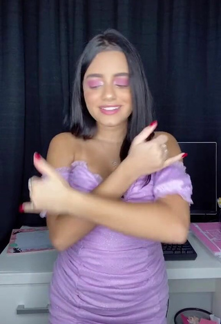 2. Sweetie Bela Almada Shows Cleavage in Purple Dress