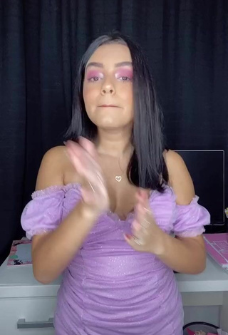 3. Sweetie Bela Almada Shows Cleavage in Purple Dress