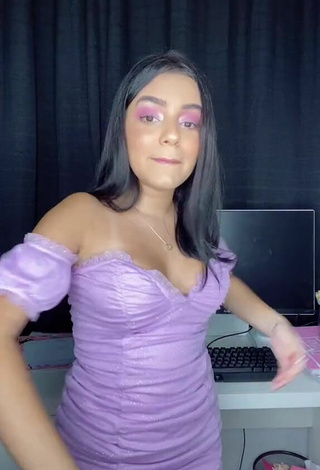 4. Sweetie Bela Almada Shows Cleavage in Purple Dress