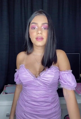 6. Sweetie Bela Almada Shows Cleavage in Purple Dress