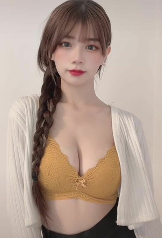 4. Hot c.0214 Shows Cleavage in Yellow Bra