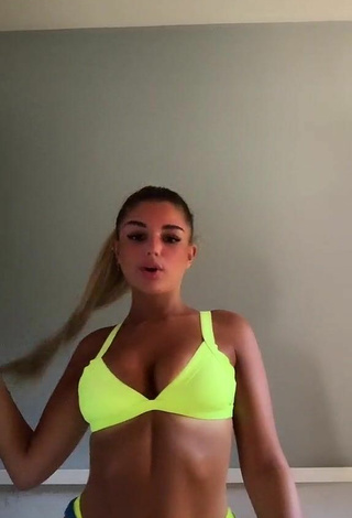 Carla Frigo Shows Cleavage in Appealing Bikini Top