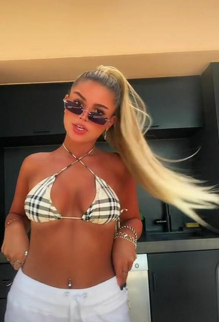2. Sensual Carla Frigo Shows Cleavage in Checkered Bikini Top