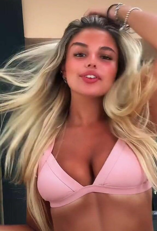 Gorgeous Carla Frigo Shows Cleavage in Alluring Pink Bikini Top