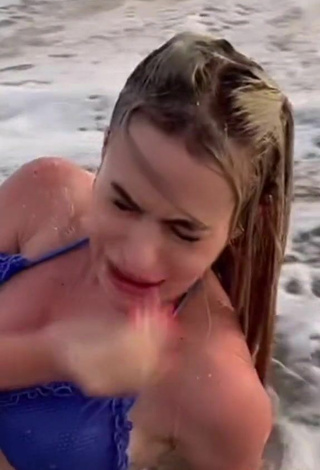 6. Sexy Dina in Blue Bikini Top at the Beach