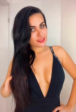 3. Erotic Dine Azevedo Shows Cleavage in Black Dress