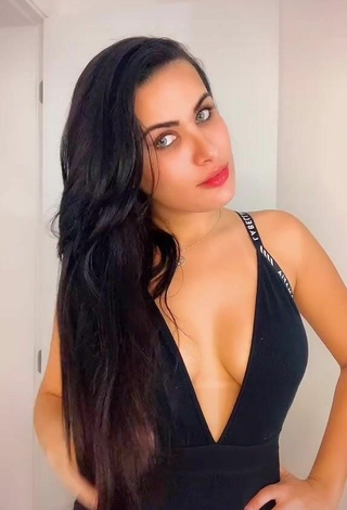 6. Erotic Dine Azevedo Shows Cleavage in Black Dress