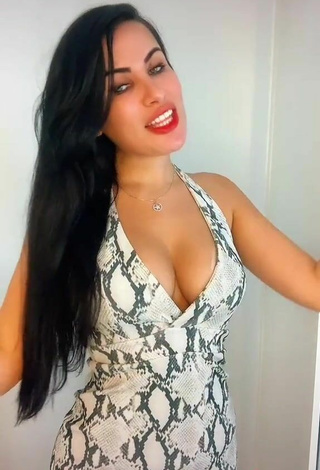5. Hottie Dine Azevedo Shows Cleavage in Snake Print Dress