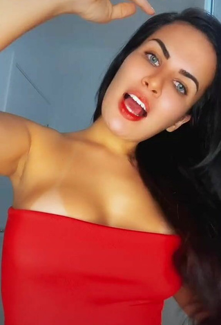 2. Seductive Dine Azevedo Shows Cleavage in Red Top