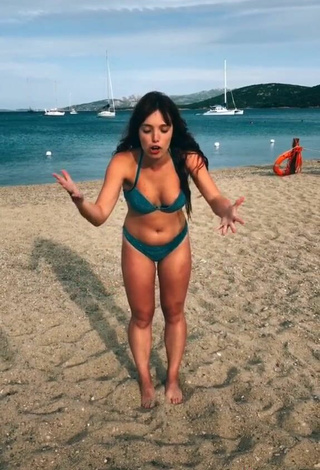 5. Hot Eleonora Olivieri Shows Cleavage in Turquoise Bikini at the Beach and Bouncing Tits